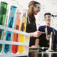 student working with beakers